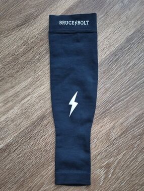 Bruce Bolt Kids Black Athletic Sleeve with White Bolt Logo NWOT